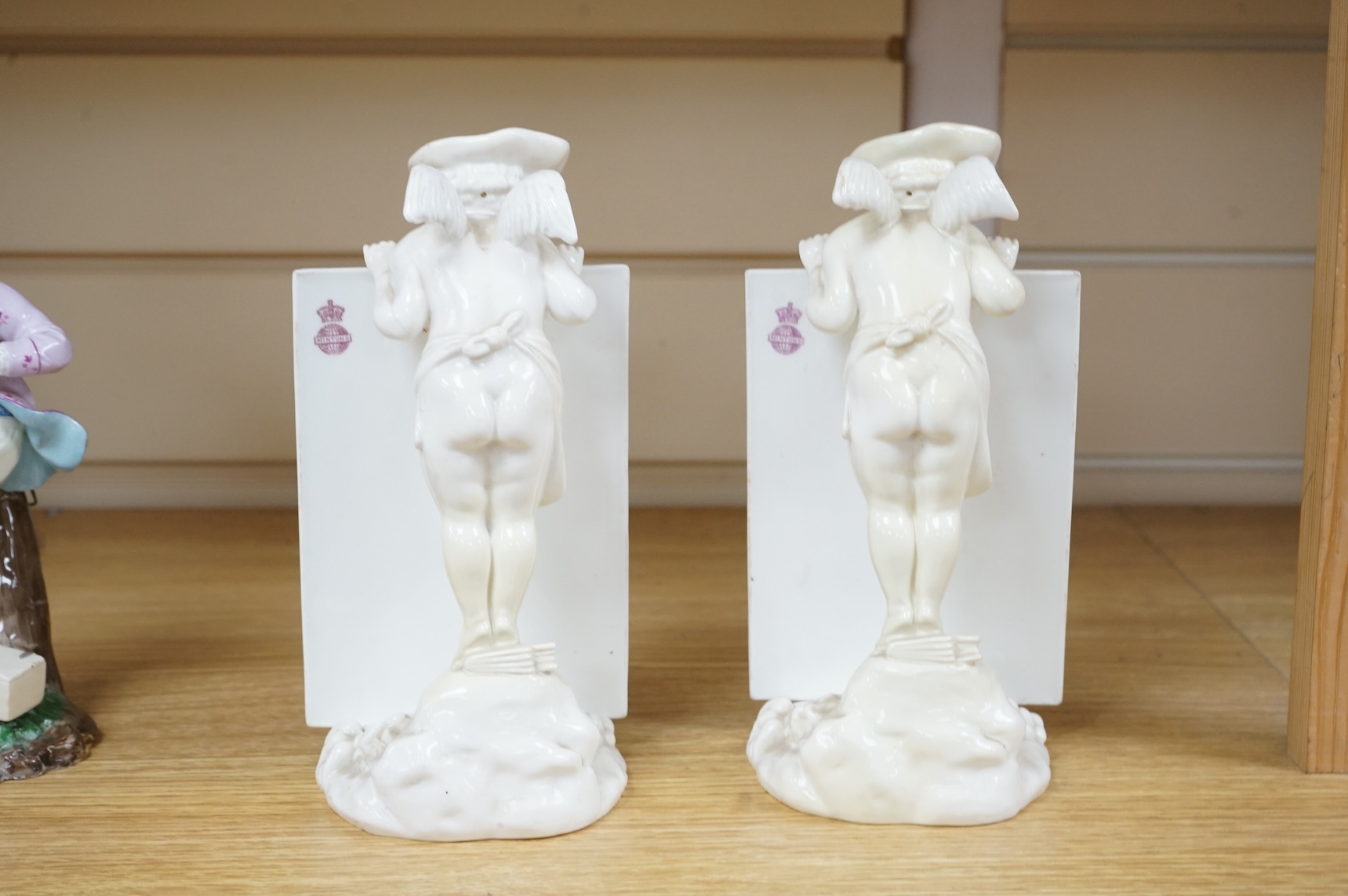 A pair of 19th century Mintons white glazed porcelain figural menu holders, 20cm